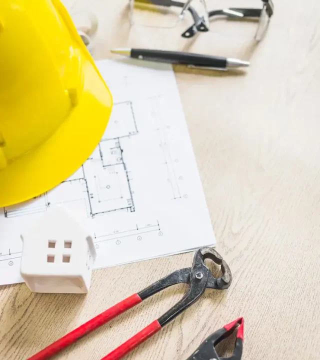 toy-house-near-safety-construction-gear_23-2147831890 toy-house-near-safety-construction-gear_23-2147831890
